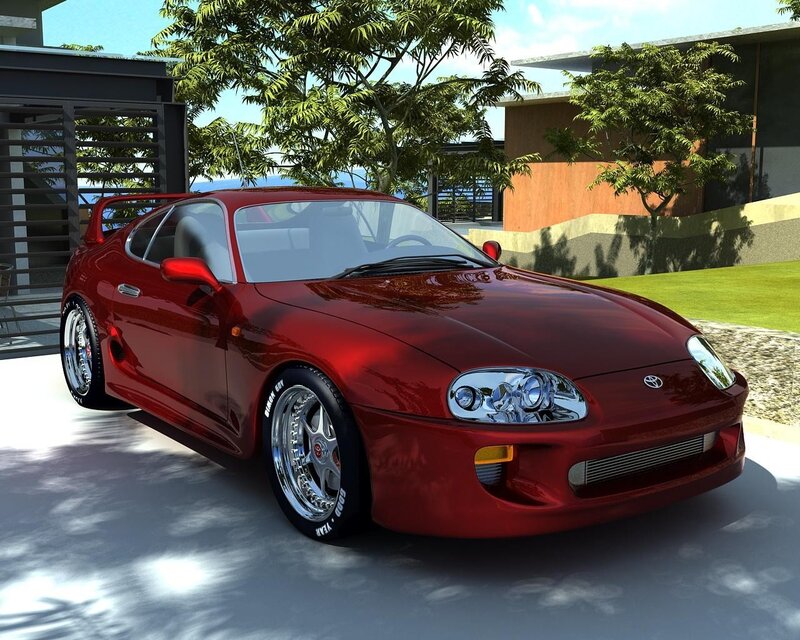 Red sports car in driveway