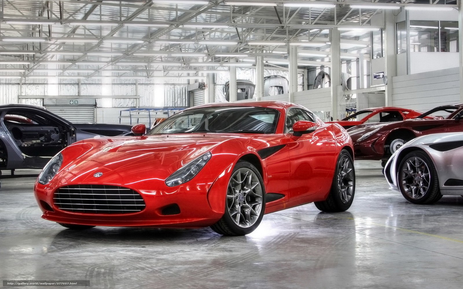 Red sports car in factory