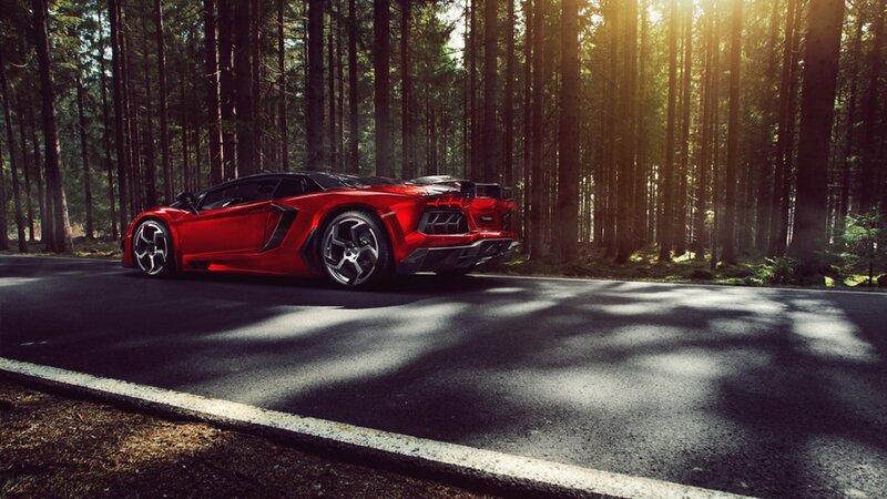 Red sports car in forest