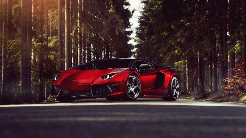 Red sports car in forest