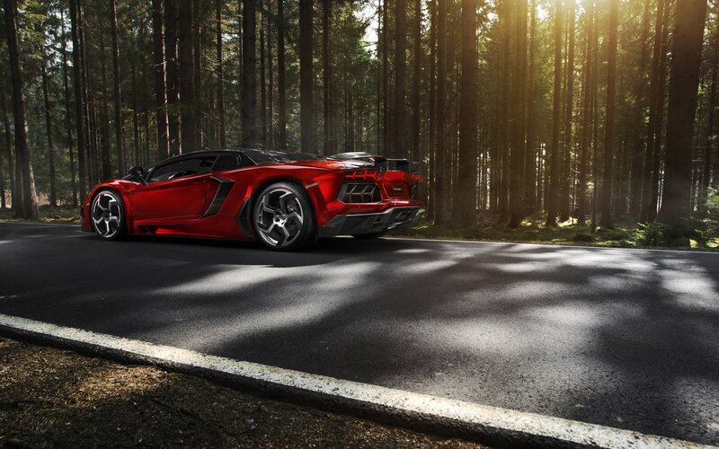 Red sports car in forest