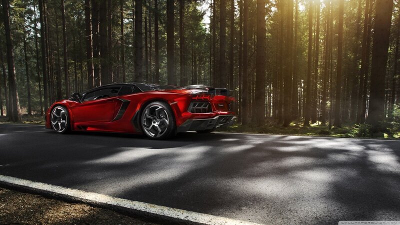 Red sports car in forest