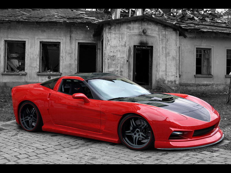 Red sports car in front of old building