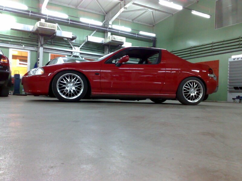 Red sports car in garage