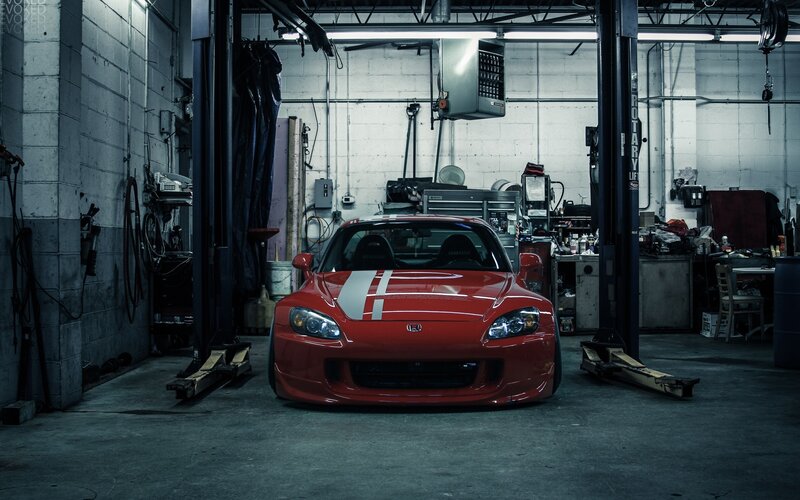 Red sports car in garage
