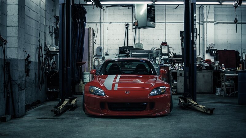 Red sports car in garage