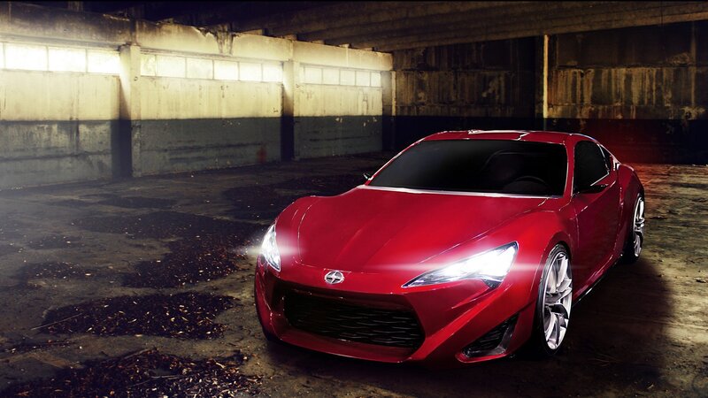 Red sports car in garage