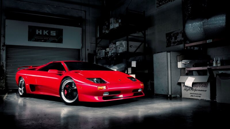 Red sports car in garage