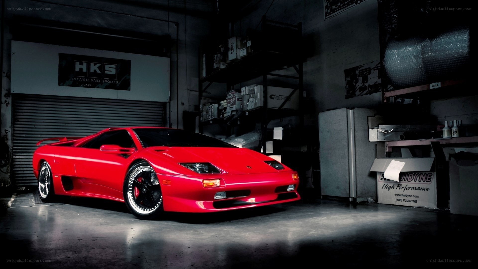 Red sports car in garage