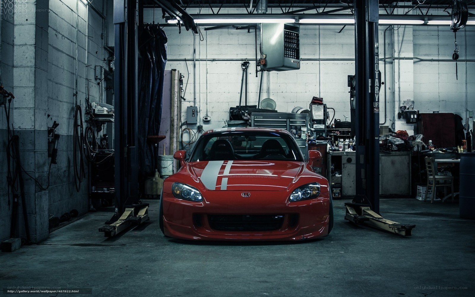 Red sports car in garage