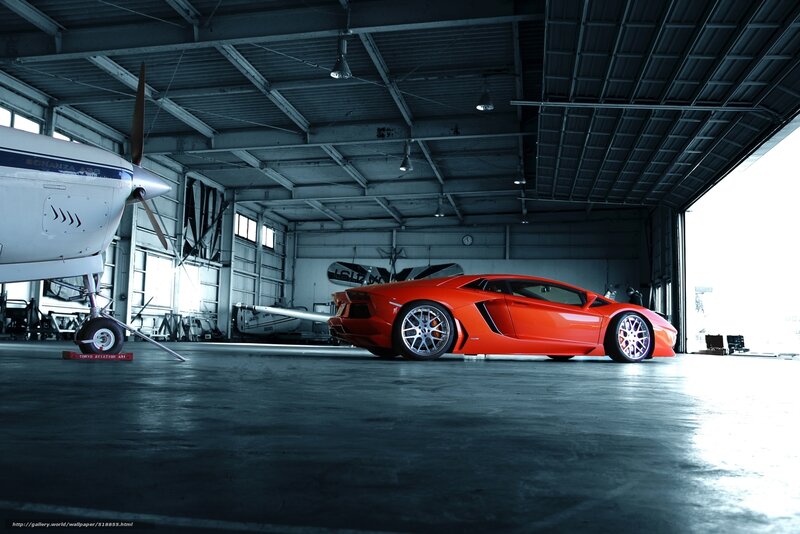 Red sports car in hangar