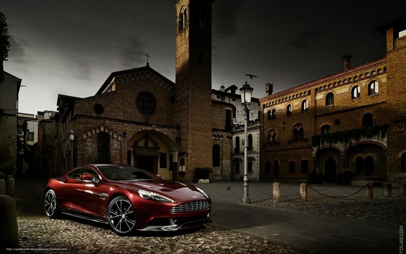 Red sports car in historic square