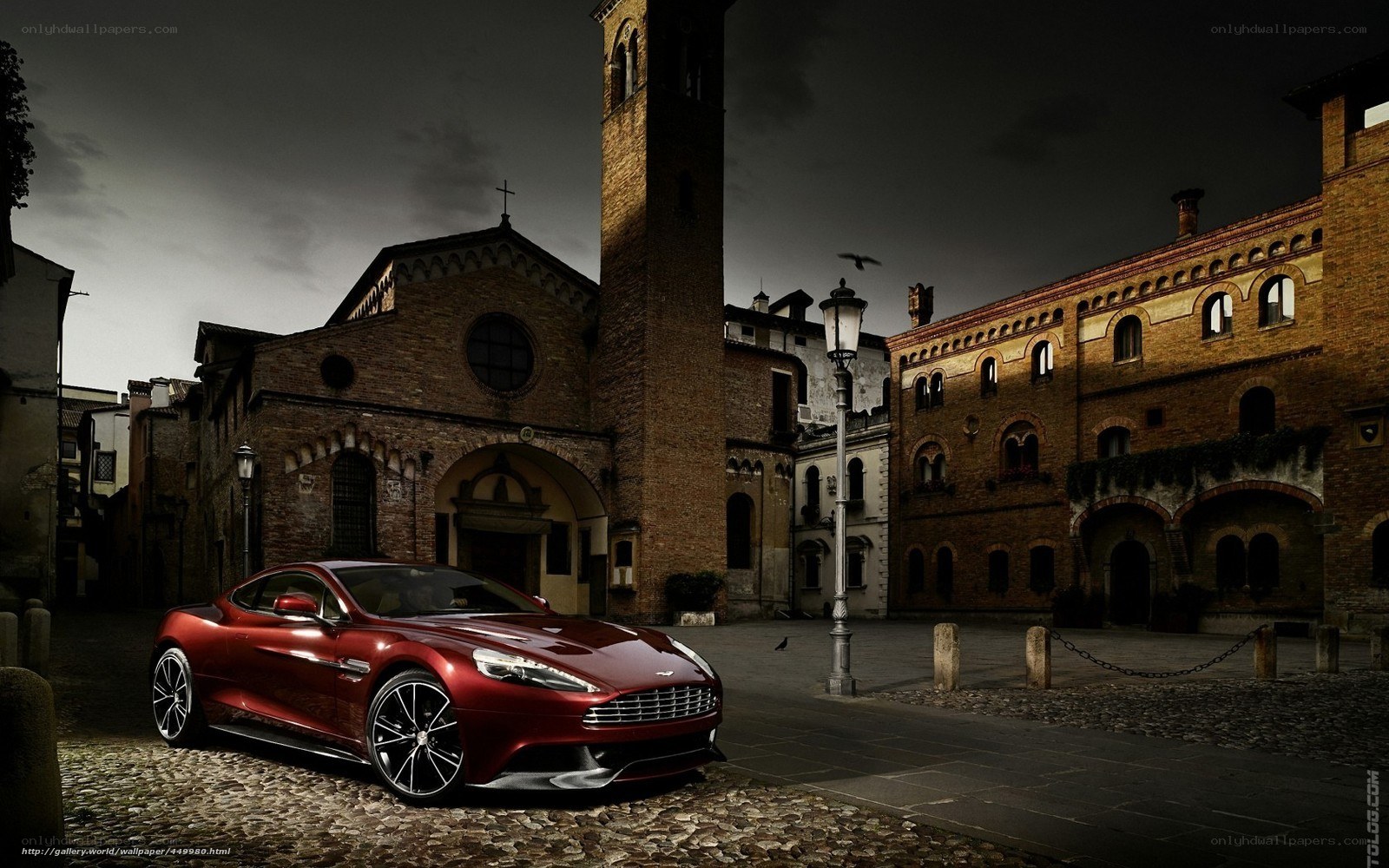 Red sports car in historic square
