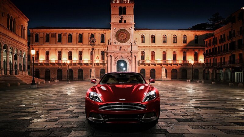 Red sports car in historic square