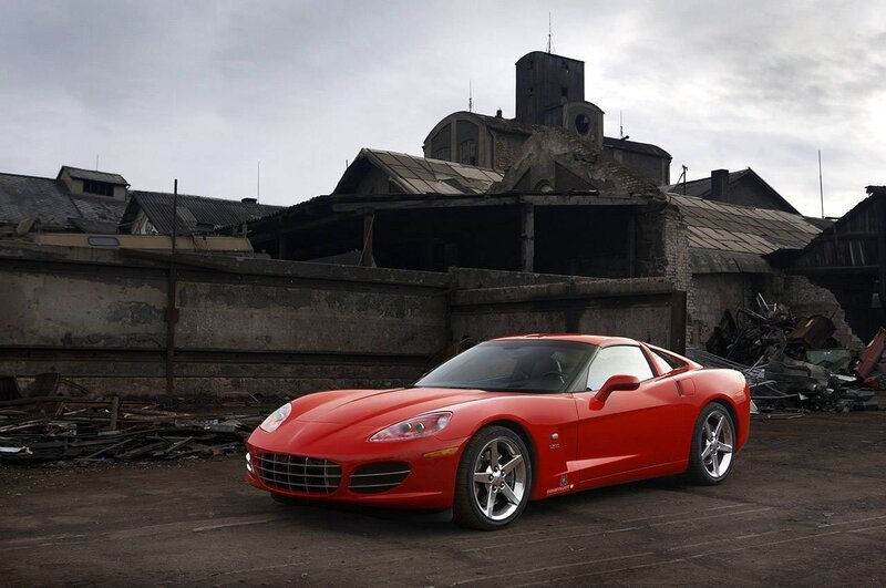 Red sports car in industrial setting