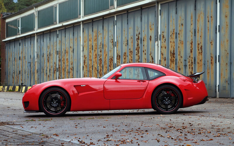 red sports car in industrial setting