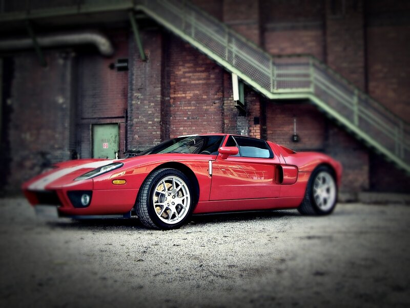 Red sports car in industrial setting