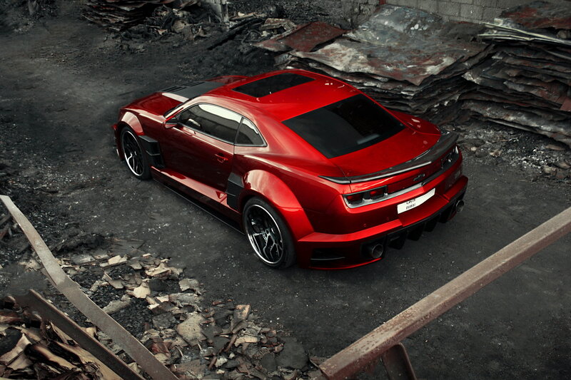 Red sports car in junkyard