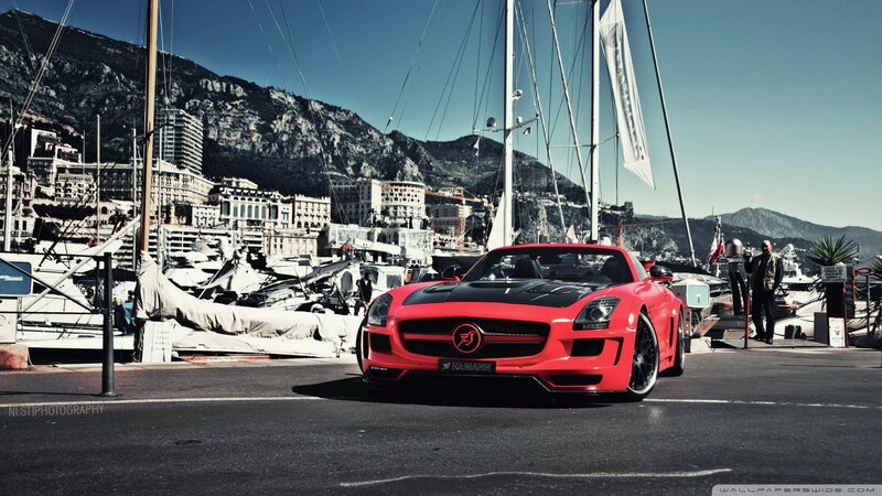 Red sports car in marina
