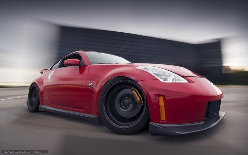 red sports car in motion