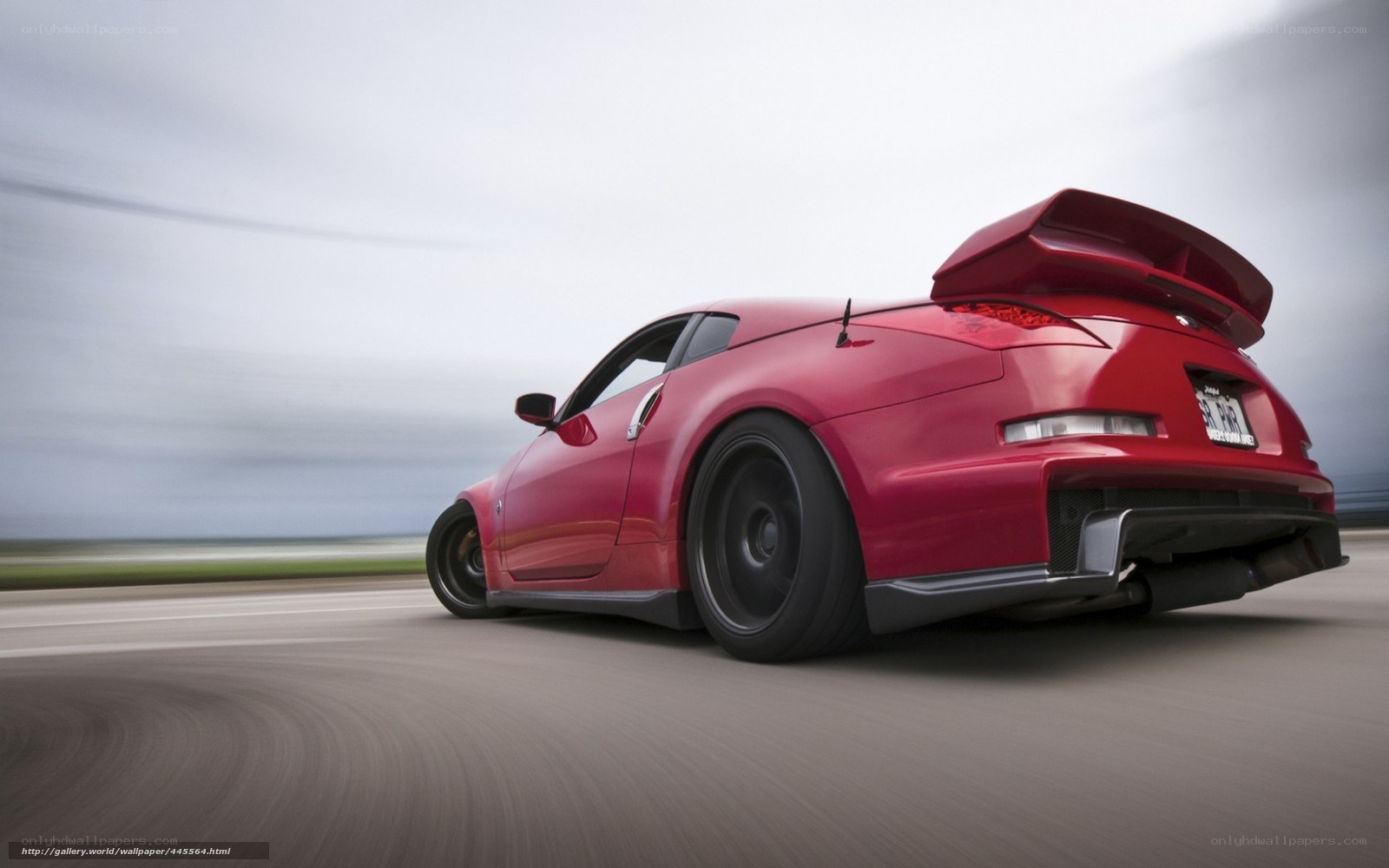 red sports car in motion
