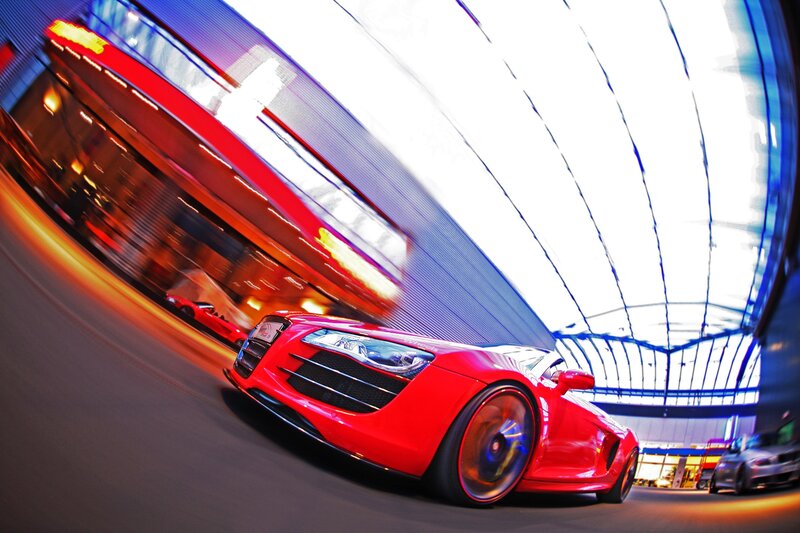 Red sports car in motion