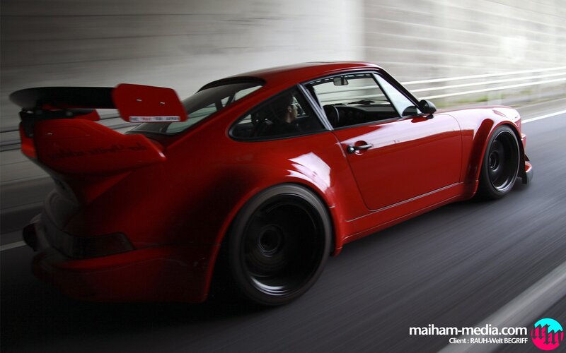 red sports car in motion