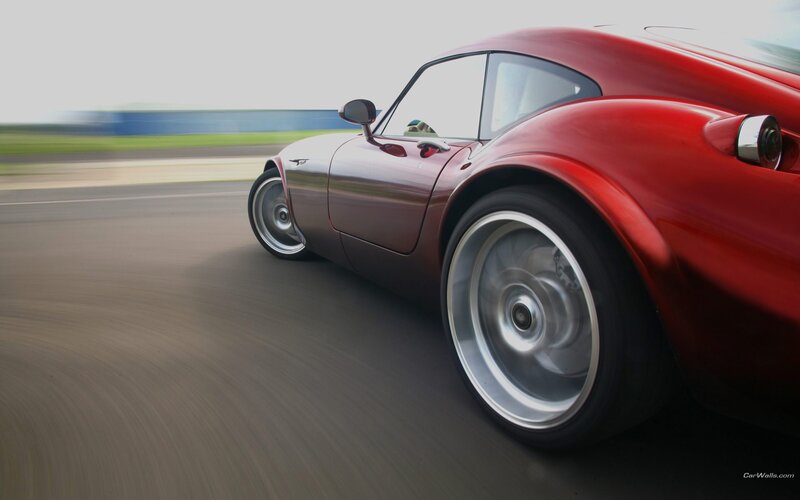 Red sports car in motion