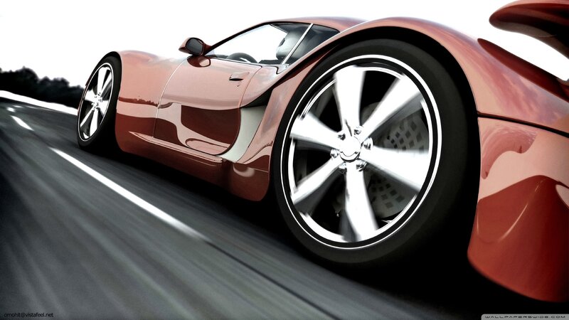 red sports car in motion
