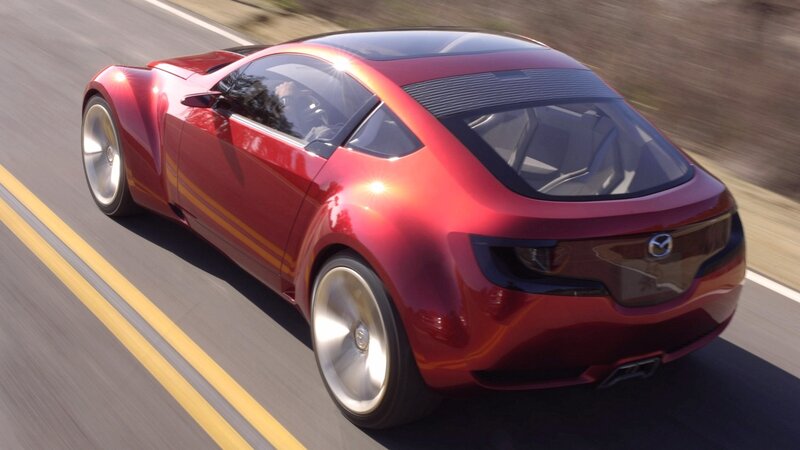 red sports car in motion