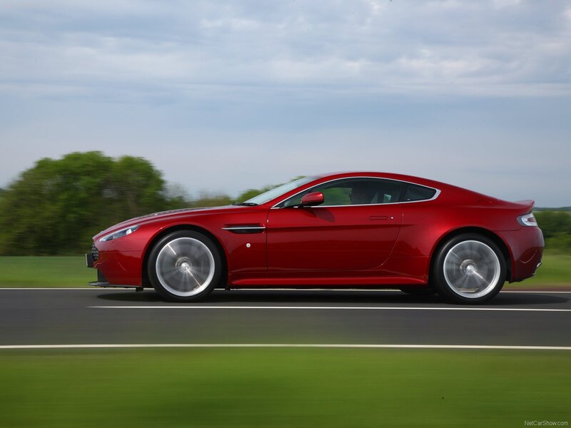 red sports car in motion