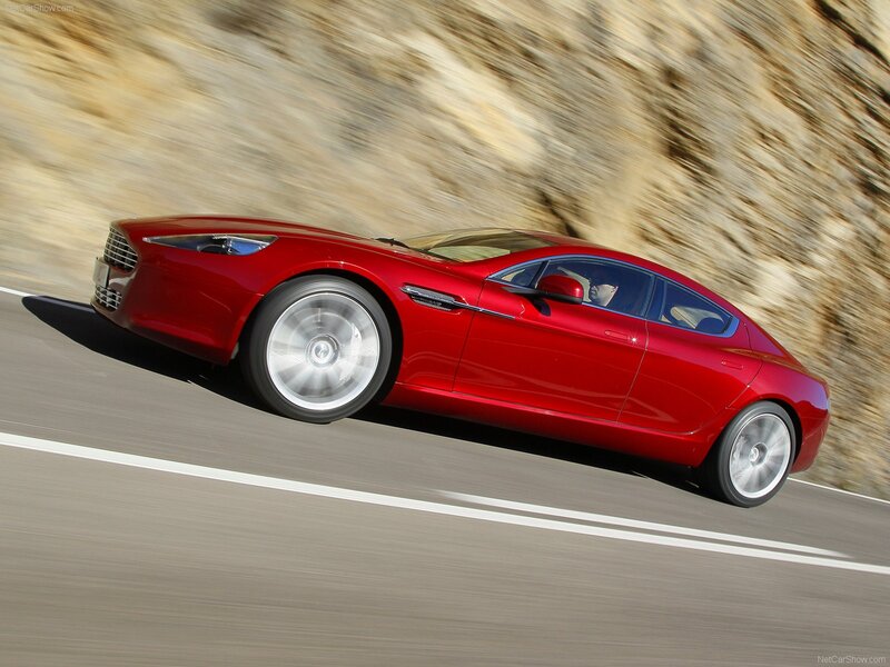 red sports car in motion