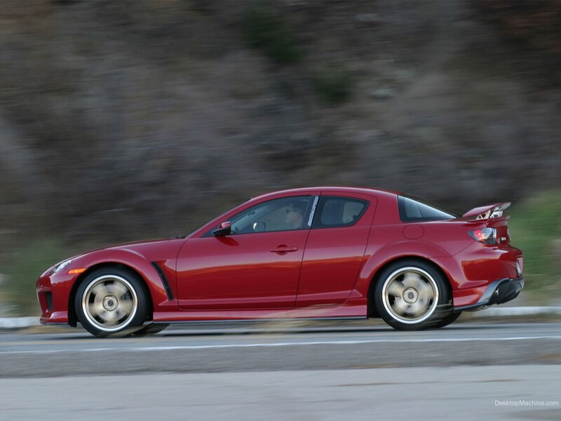 red sports car in motion