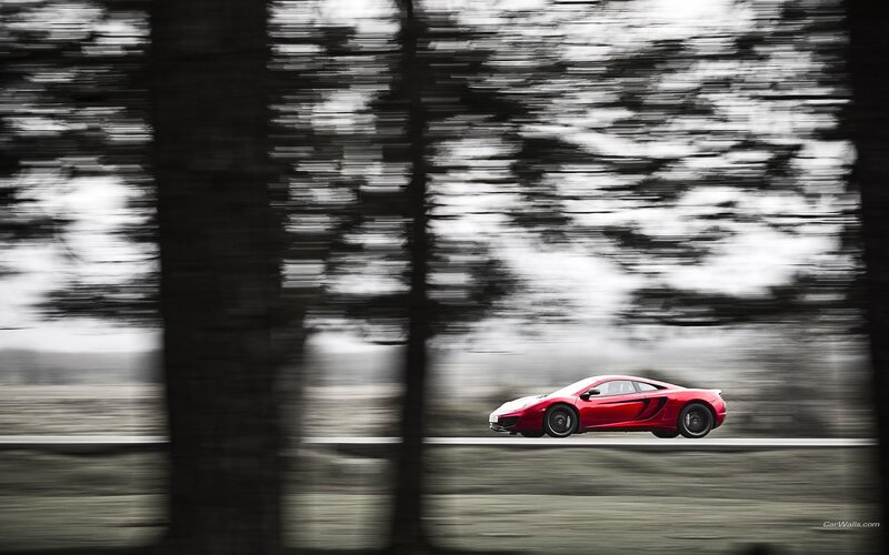 Red sports car in motion