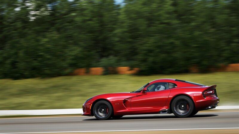red sports car in motion