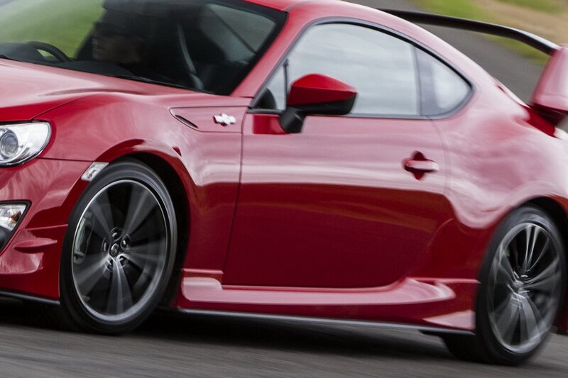 Red sports car in motion