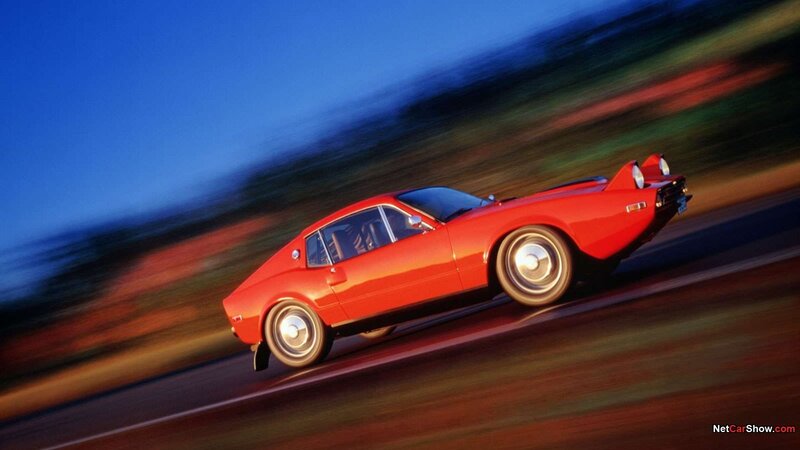 Red sports car in motion