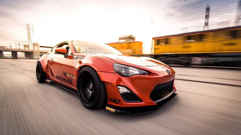 Red sports car in motion