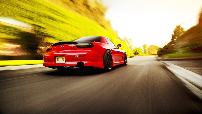 red sports car in motion