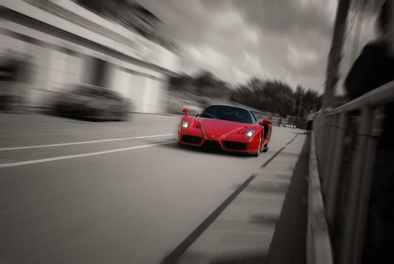 Red sports car in motion
