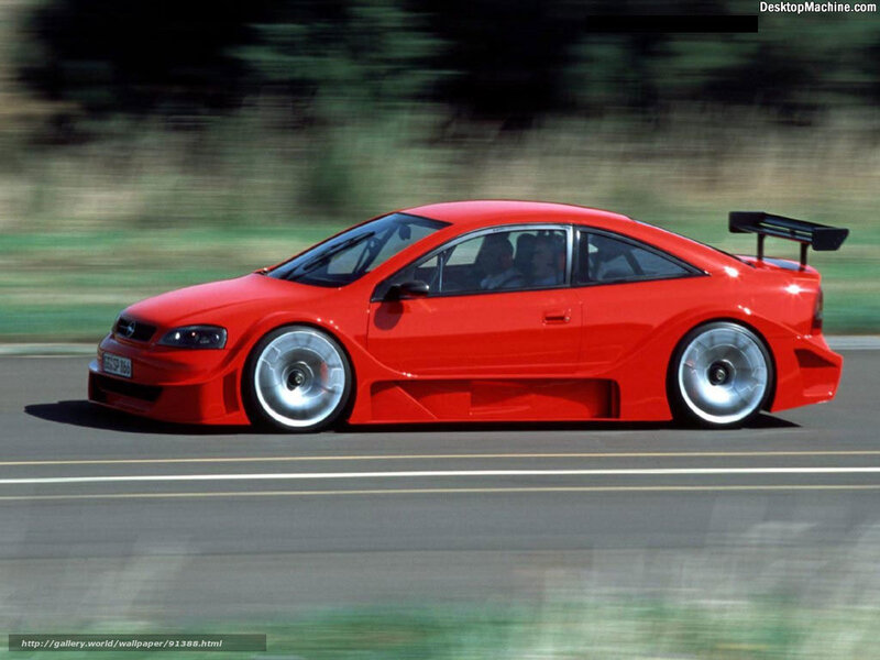 red sports car in motion
