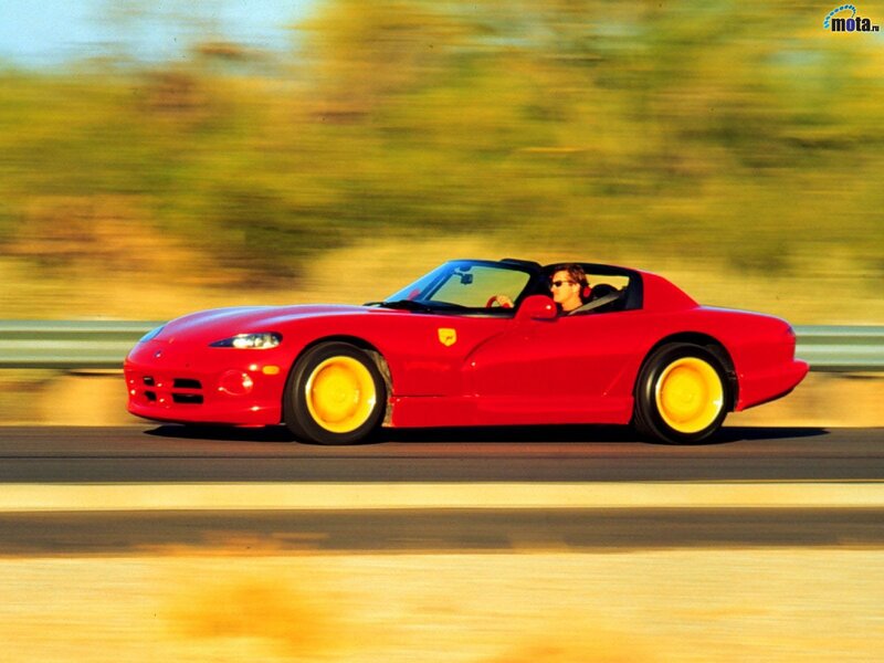 Red sports car in motion