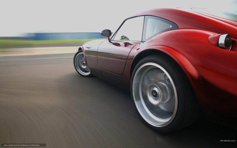 Red sports car in motion