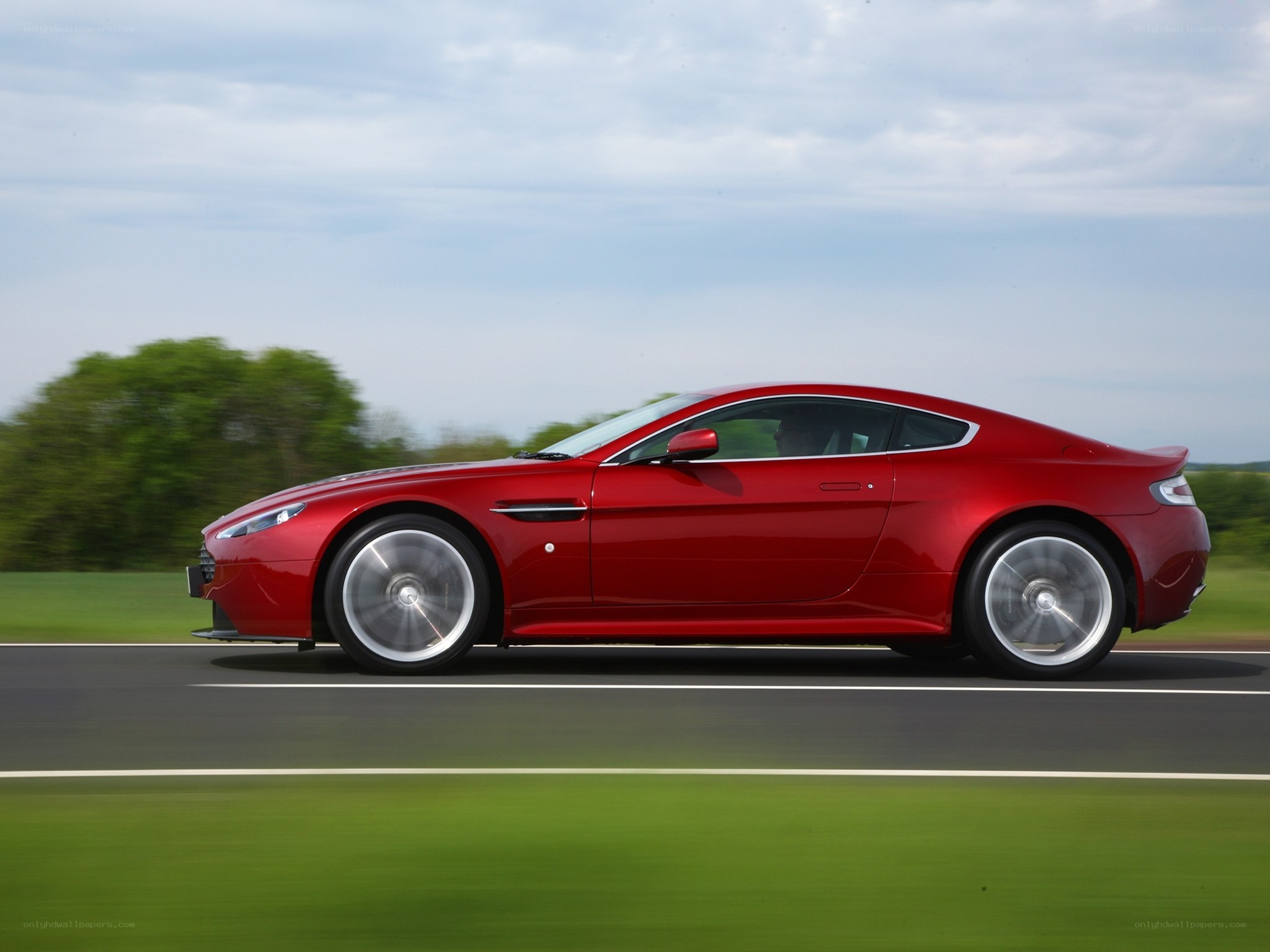 Red sports car in motion