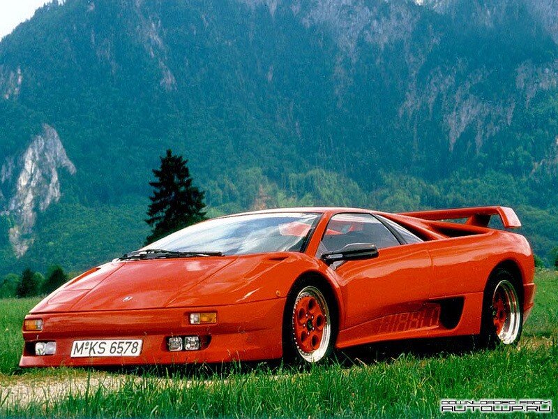 red sports car in mountain landscape