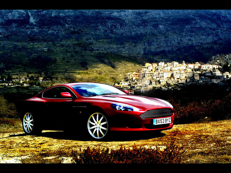 Red sports car in mountain village