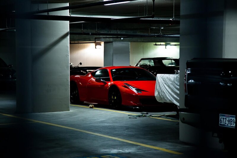 Red sports car in parking garage