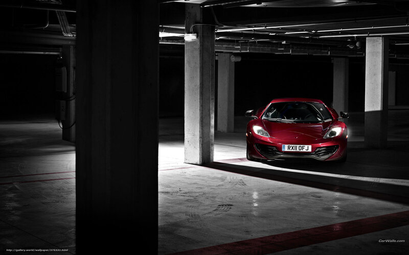 Red sports car in parking garage