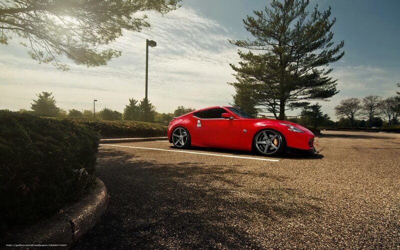 Red sports car in parking lot
