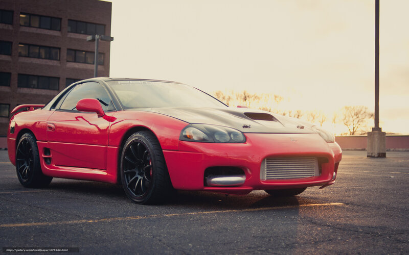 Red sports car in parking lot